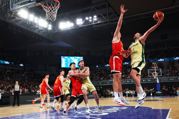 Joe Ingles attempts a scoop shot over China.