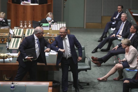 The Prime Minister and Opposition Leader Anthony Albanese elbow bump after delivering end-of-year statements to the House of Representatives in December.