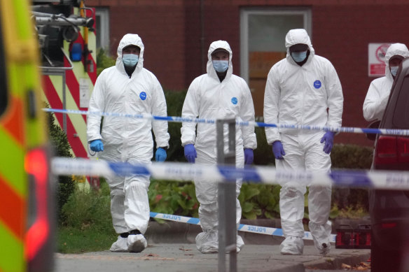 Police and forensic officers at the site of the explosion in Liverpool.