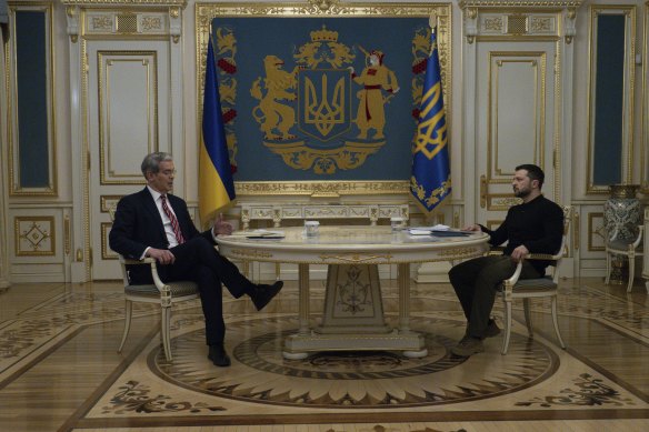 US Treasury Secretary Scott Bessent talks to Ukraine’s President Volodymyr Zelensky as he presents a draft agreement on natural resources to Ukraine in Kyiv.