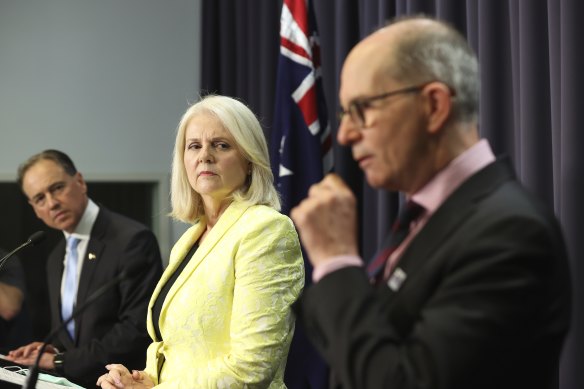 “We are committed to continue to reopen,” says Chief Medical Officer Paul Kelly, with Health Minister Greg Hunt and Home Affairs Minister Karen Andrews.