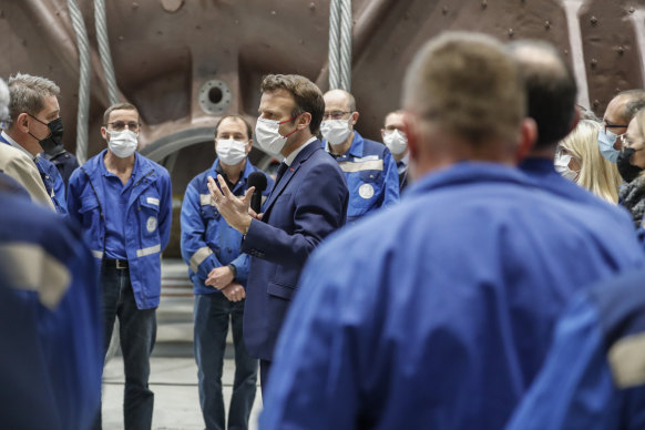 French President Emmanuel Macron talks to officials and workers at a nuclear turbine production site in Belfort on what was not (officially) a campaign visit.