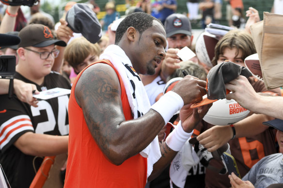 Cleveland Browns quarterback Deshaun Watson signs autographs at the team’s pre-season training camp in Ohio on Monday.