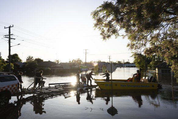 People board a boat in Forbes. 