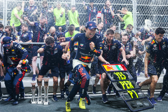 Mexican driver Sergio Perez celebrates Oracle Red Bull’s domination of the Saudi Arabian race with teammate and runner-up Max Verstappen and their team after the F1 Grand Prix at the Jeddah Corniche Circuit on Sunday.