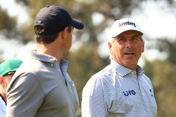 McIlroy chats with Fred Couples.