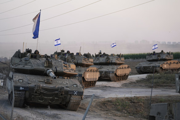 Israeli tanks head towards the Gaza Strip border in southern Israel.