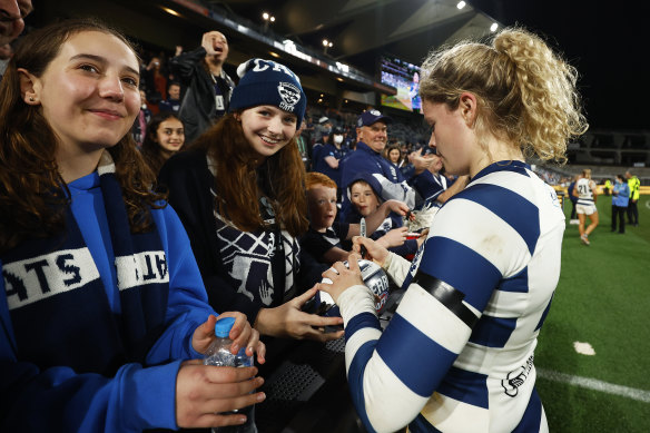 Georgie Prespakis of the Cats greets fans after the win over St Kilda.