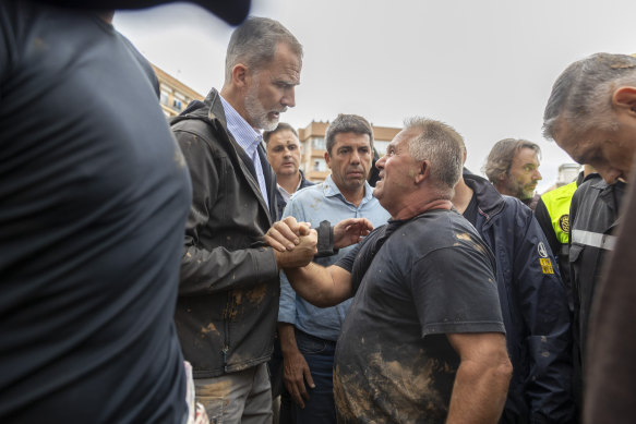 Spain’s King Felipe VI (left) was heckled and had mud thrown at him when he visited Paiporta on Sunday.
