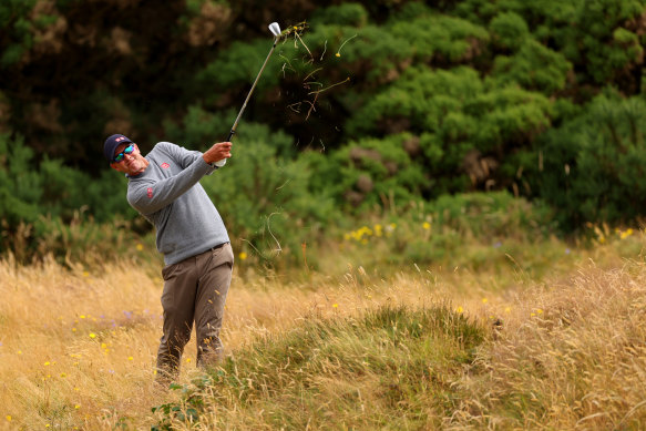 Adam Scott plays his third shot on the 11th hole on a rugged day at the Open.