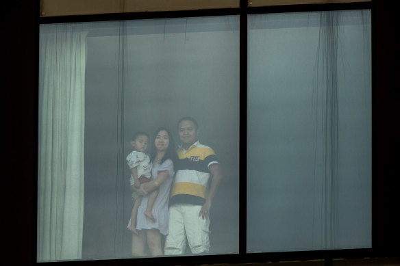 Ha Phung and Vu Nguyen, with three-year-old son Sam, are in hotel quarantine at the Pan Pacific in South Wharf. 