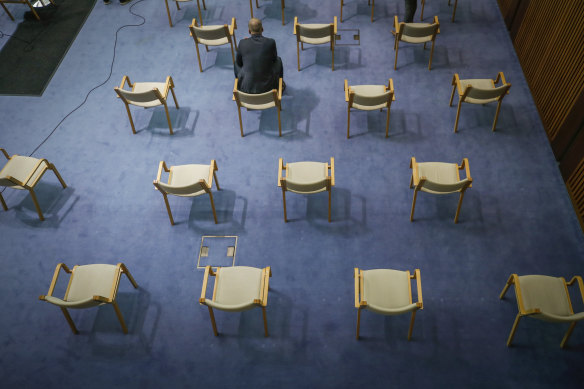 A ministerial adviser observes social distancing as chief health officers warned undiagnosed cases could spiral.