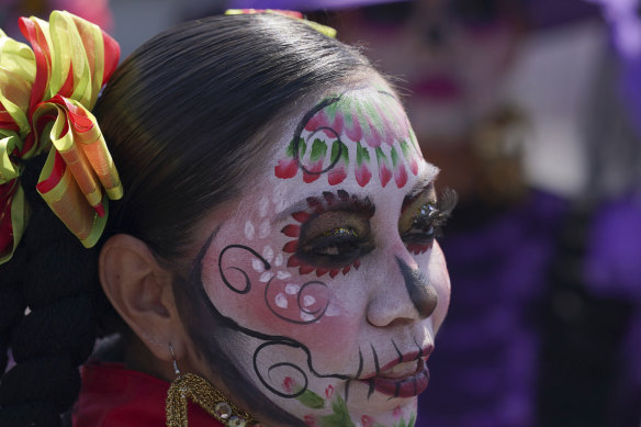 A woman dressed as a “Catrina” on the Day of the Dead in Mexico City.