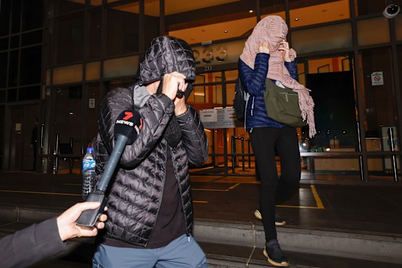 The parents of Ryan Cho leave the Melbourne Magistrates’ Court on Friday night.