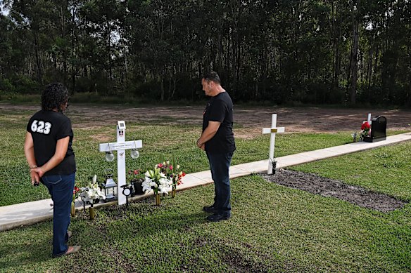 Paul and Lafo Titmuss at the grave of their son Keith Titmuss.