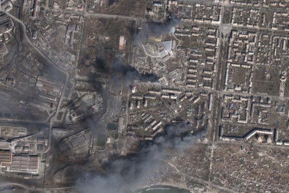 Multiple civilian buildings burn amid Russian strikes on the Livoberezhnyi District of Mariupol, Ukraine.