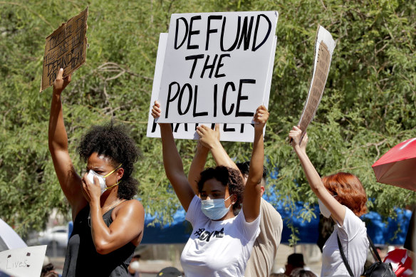 Protesters rally on June 3 in Phoenix, Arizona, demanding the city council defund the city's police department. 