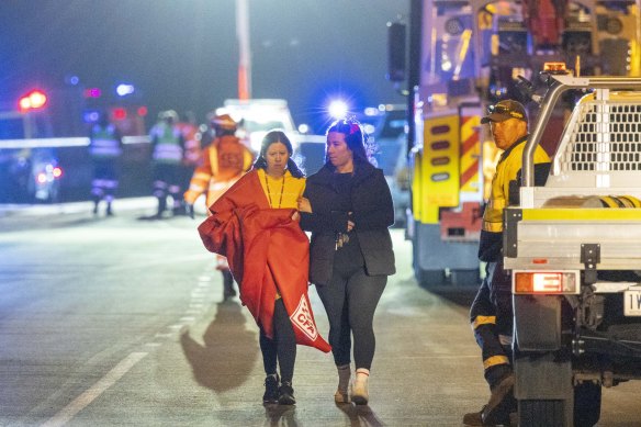 People leave the scene of the crash on Tuesday evening.