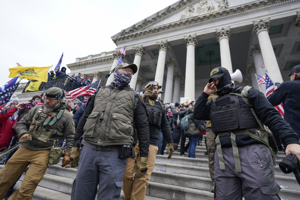Members of the Oath Keepers extremist group stand on the east front of the US Capitol on January 6, 2021.