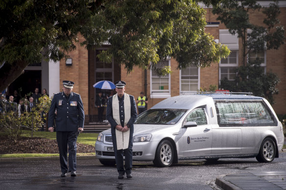 The sun broke through as Chief Commissioner Graham Ashton led the hearse out of the academy grounds.