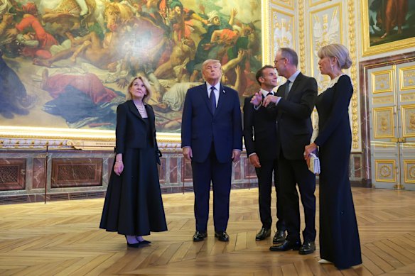From left, Minister of Culture Catherine Pegard, Trump, Emmanuel Macron, Laurent Salome, and Brigitte Macron take a tour of Chateau de Versailles ahead of the dinner.