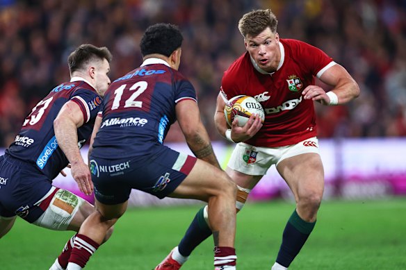 Huw Jones of the British & Irish Lions runs at the defence
