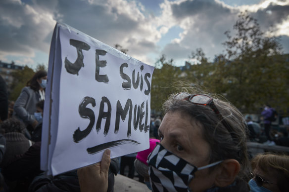 An anti-terrorism protestor at Paris' Place de La Republique following the brutal killing of teacher Samuel Paty.
