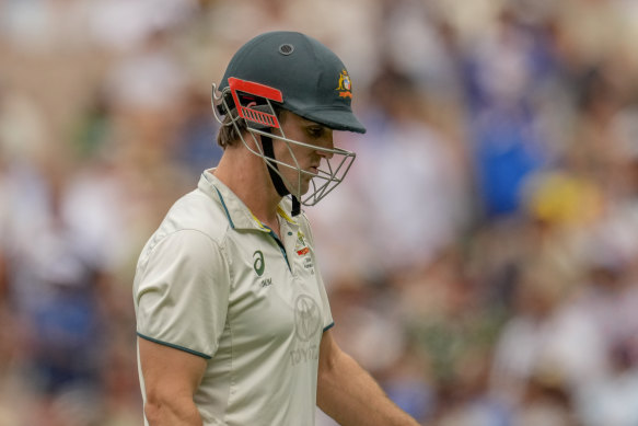 Mitchell Marsh heads back to the rooms after being dismissed.