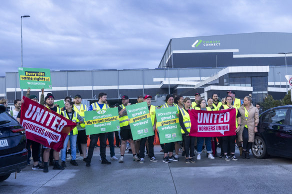 Dozens of union members outside the Woolworths distribution centre on Tuesday. Numbers were fewer than on Monday.