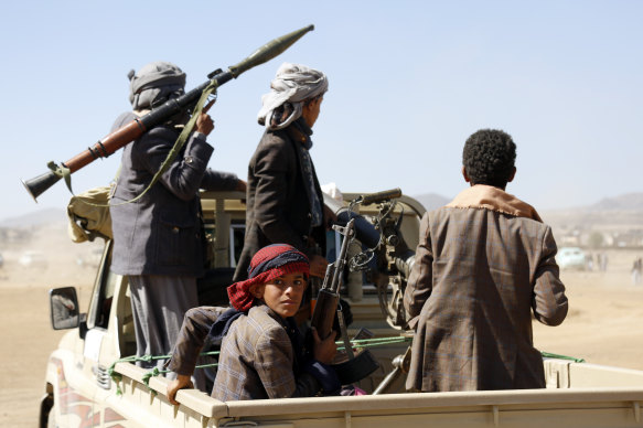 Houthi fighters and tribesmen near Sanaa in Yemen on Sunday.
