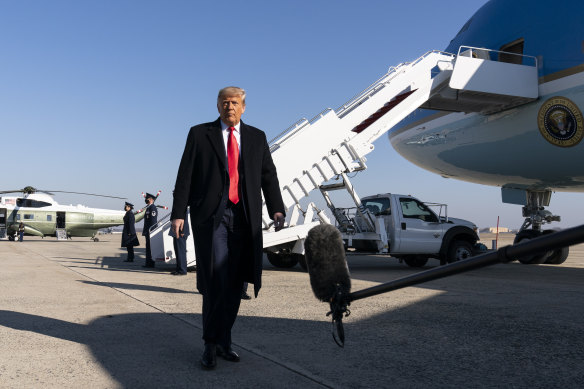 President Donald Trump prepares to board Air Force One for a trip to Texas on January 12.