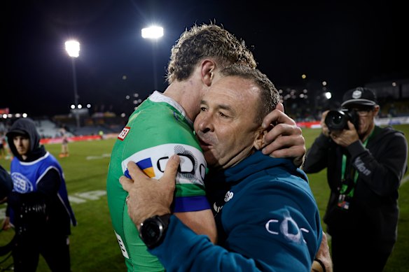 Jed Stuart and Ricky Stuart embrace after the Raiders beat the Tigers.