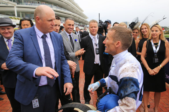 Danny O'Brien, left, talks to jockey Damien Oliver after winning race two with Miami Bound during Derby day. 
