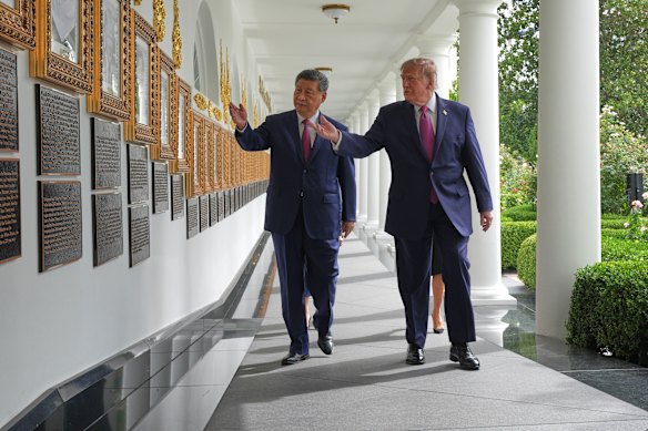 US President Donald Trump and China’s President Xi Jinping walk along the Colonnade of the White House.
