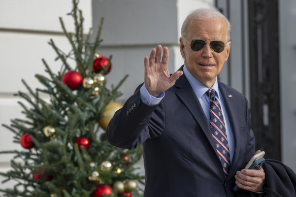 US President Joe Biden waves as he walks to Marine One to depart the South Lawn.