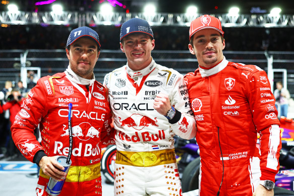 Dutchman Max Verstappen, who won the Las Vegas Grand Prix, with placegetters Charles Leclerc and Sergio Perez.