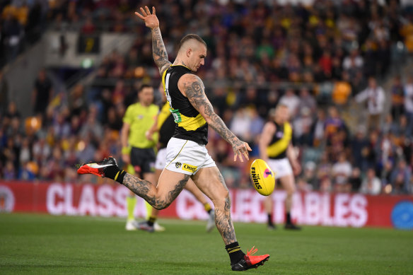 Dustin Martin of the Tigers kicks one of six goals in a dominating display. 