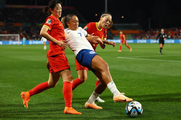 England’s Lauren James in action with China’s Li Mengwen and Yao Lingwei.