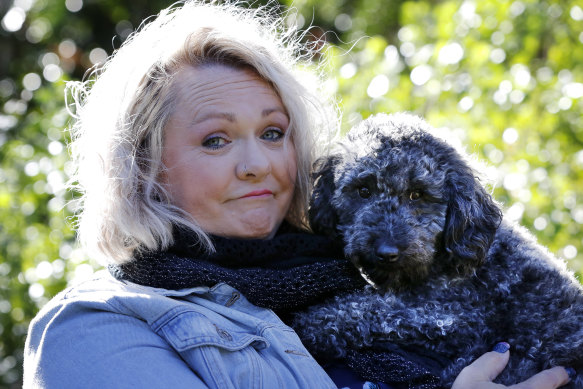Prue Bamford with her dog Lux. She is no longer licensed to care for wildlife because of conflict with her local group.