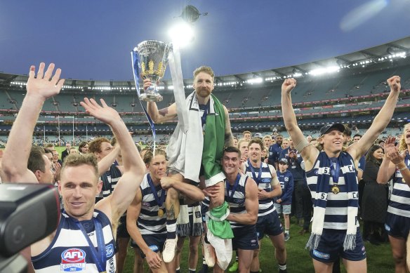 Zach Tuohy was carried from the ground draped in the Irish flag after winning a premiership in his 250th game