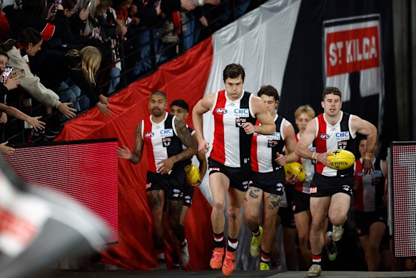 Jack Steele leads the Saints out for Sunday’s game before starting as his team’s substitute.