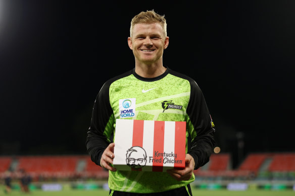 Did someone say KFC? Sam Billings with his player of the match ‘trophy’.