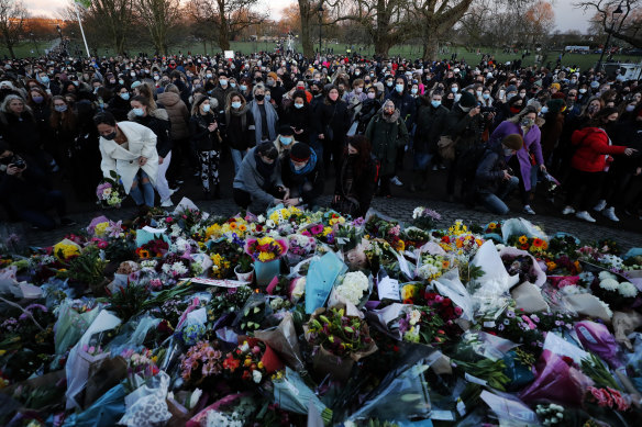 People gather, at the band stand in Clapham Common, in memory of Sarah Everard, after an official vigil was  cancelled in March 2021.