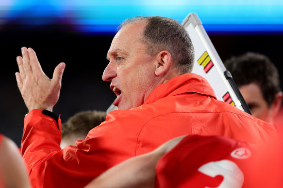 John Longmire has returned serve at Collingwood coach Craig McRae.