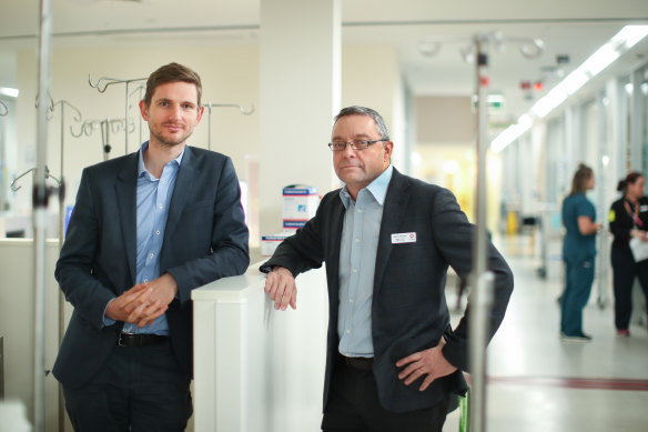 Dr Aidan Burrell with another intensive care doctor David Pilcher, who have been closely monitoring data on COVID-19 patients.