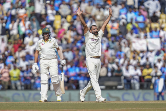 India’s Mohammed Shami,right, celebrates the dismissal of Australia’s Scott Boland.