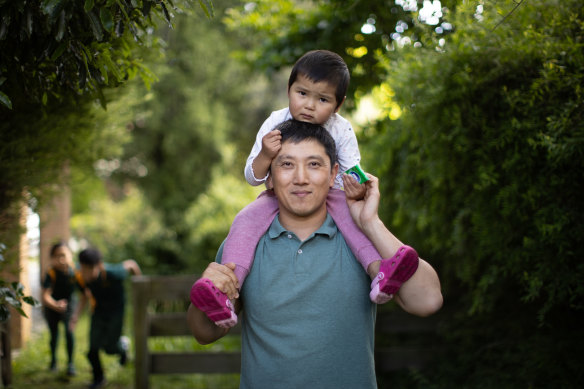Orgil Tumurbaatar, a data analyst, is able to spend Fridays with his children now that Our Community has moved to a four-day week.