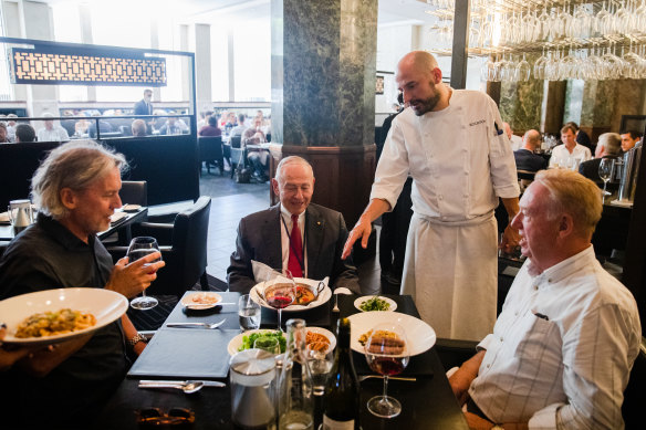Rockpool head chef Corey Costelloe serves regular and former ABC chairman Maurice Newman (centre), author and journalist Fred Pawle (left) and The Australian’s commercial editor Steve Waterson..