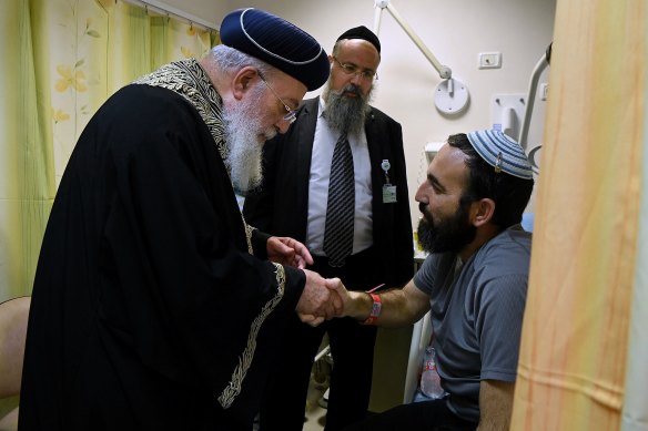 Rabbi Shachar Butzchak (right) is visited by Chief Rabbi of Jerusalem Shlomo Amar.