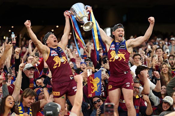 Dayne Zorko and Lachie Neale celebrate another premiership.